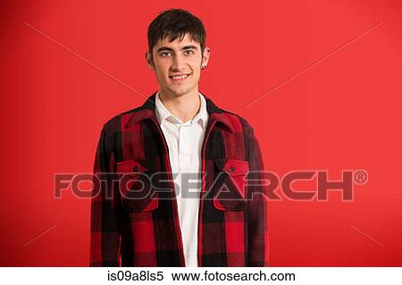 Stock Photography - Portrait of young man wearing checked shirt. Fotosearch