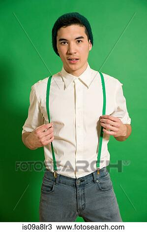 Portrait of young man wearing green braces View Large Photo Image Stock Image - Portrait of young man wearing green braces. Fotosearch