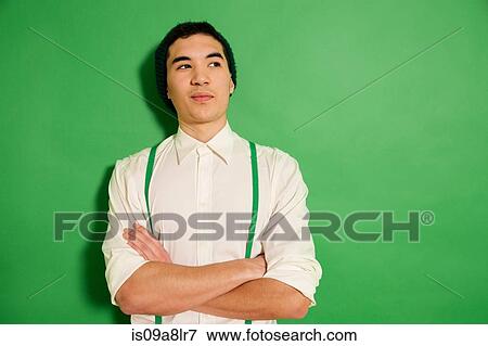 Portrait of young man wearing green braces View Large Photo Image Stock Photo - Portrait of young man wearing green braces. Fotosearch