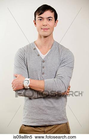 Portrait of young man wearing grey jumper View Large Photo Image Stock Photography - Portrait of young man wearing grey jumper. Fotosearch
