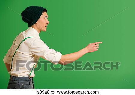 Stock Photography - Portrait of young man wearing knit hat. Fotosearch