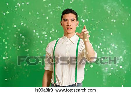 Portrait of young man with glitter View Large Photo Image Stock Photo - Portrait of young man with glitter. Fotosearch