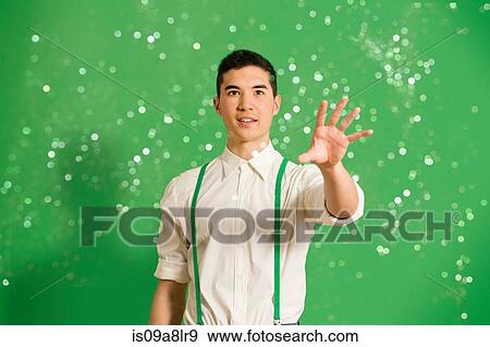 Portrait of young man with glitter View Large Photo Image Stock Photo - Portrait of young man with glitter. Fotosearch
