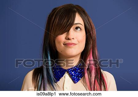 Portrait of young woman with dyed hair and blue sequin collar View Large Photo Image Stock Image - Portrait of young woman with dyed hair and blue sequin collar. Fotosearch