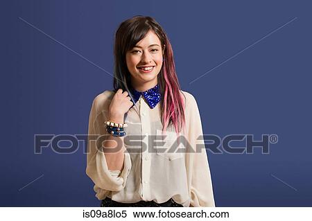 Stock Photography - Portrait of young woman with dyed hair. Fotosearch