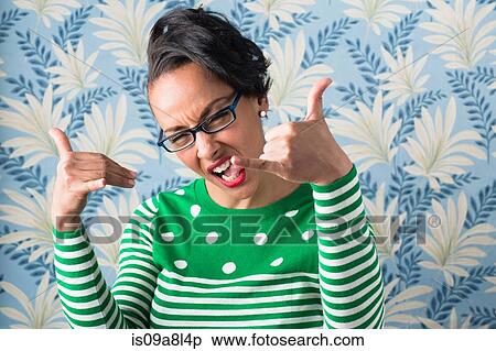 Stock Photography - Retro style portrait of woman with thumbs up. Fotosearch