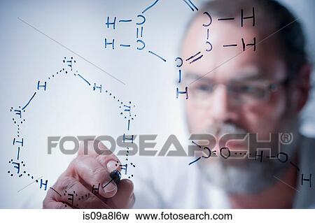 Scientist writing scientific symbols on glass View Large Photo Image Stock Photo - Scientist writing scientific symbols on glass. Fotosearch