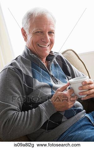 Senior man with cup of coffee View Large Photo Image Stock Image - Senior man with cup of coffee. Fotosearch