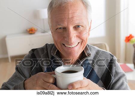 Stock Image - Senior man with cup of coffee. Fotosearch