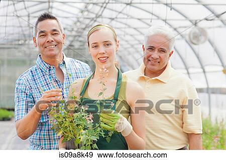 Senior, mature man and mid adult woman in garden centre, portrait View Large Photo Image Stock Photo - Senior, mature man and mid adult woman in garden centre, portrait. Fotosearch