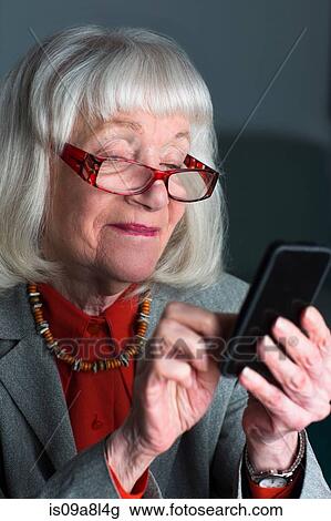 Senior woman using smartphone View Large Photo Image Stock Image - Senior woman using smartphone. Fotosearch