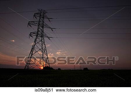 Silhouette of electrical towers at sunset View Large Photo Image Stock Image - Silhouette of electrical towers at sunset. Fotosearch