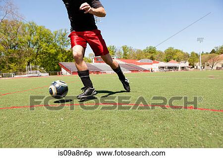 Soccer player running down pitch with ball View Large Photo Image Stock Photography - Soccer player running down pitch with ball. Fotosearch
