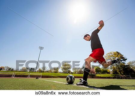 Soccer player taking free kick View Large Photo Image Stock Photo - Soccer player taking free kick. Fotosearch