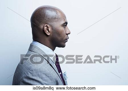 Studio portrait of businessman in profile View Large Photo Image Stock Photography - Studio portrait of businessman in profile. Fotosearch