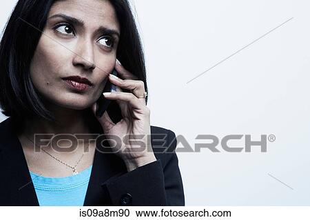 Studio portrait of businesswoman on cellphone View Large Photo Image Stock Image - Studio portrait of businesswoman on cellphone. Fotosearch