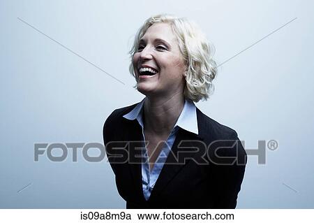Studio portrait of businesswoman laughing View Large Photo Image Stock Image - Studio portrait of businesswoman laughing. Fotosearch