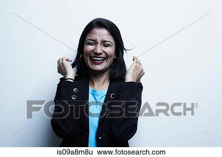 Studio portrait of businesswoman laughing View Large Photo Image Stock Photograph - Studio portrait of businesswoman laughing. Fotosearch