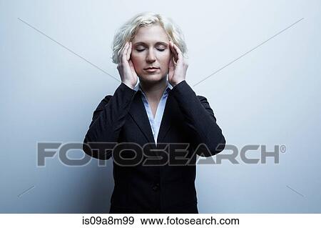 Studio portrait of businesswoman with hands on face View Large Photo Image Stock Photo - Studio portrait of businesswoman with hands on face. Fotosearch