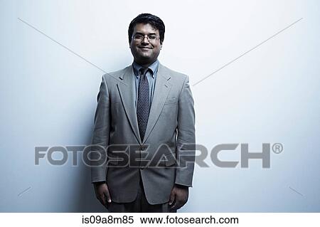 Studio portrait of mid adult male in suit View Large Photo Image Stock Photography - Studio portrait of mid adult male in suit. Fotosearch