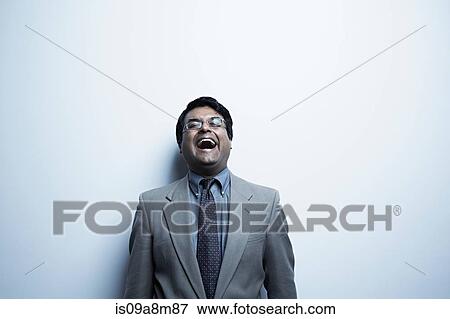Studio portrait of mid adult male laughing View Large Photo Image Stock Photo - Studio portrait of mid adult male laughing. Fotosearch