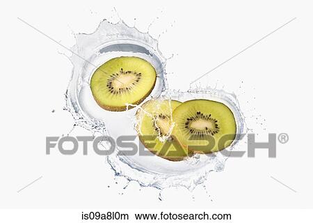 Three slices of kiwi splashing in liquid View Large Photo Image Picture - Three slices of kiwi splashing in liquid. Fotosearch