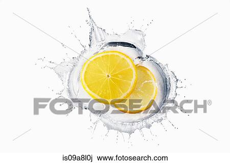 Two slices of lemon splashing in liquid View Large Photo Image Stock Image - Two slices of lemon splashing in liquid. Fotosearch
