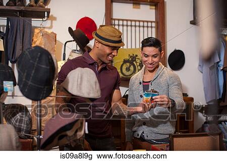 Two young men in vintage shop View Large Photo Image Stock Image - Two young men in vintage shop. Fotosearch