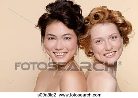 Two young women, one brunette and one redhead View Large Photo Image Stock Image - Two young women, one brunette and one redhead. Fotosearch