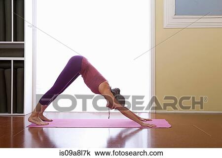 Stock Image - Woman doing yoga. Fotosearch