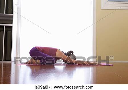 Stock Image - Woman doing yoga. Fotosearch