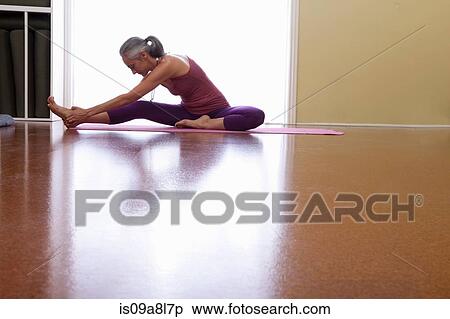 Woman stretching leg View Large Photo Image Stock Photography - Woman stretching leg. Fotosearch