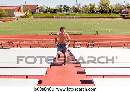 Young athlete training on stadium steps View Large Photo Image Stock Photograph - Young athlete training on stadium steps. Fotosearch