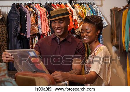 Young couple choosing vinyl records in vintage shop View Large Photo Image Stock Image - Young couple choosing vinyl records in vintage shop. Fotosearch