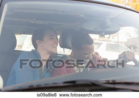 Stock Photo - Young couple in car. Fotosearch