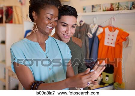 Stock Photo - Young couple in vintage shop. Fotosearch