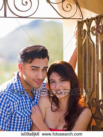 Young man and woman smiling, portrait View Large Photo Image Stock Photograph - Young man and woman smiling, portrait. Fotosearch