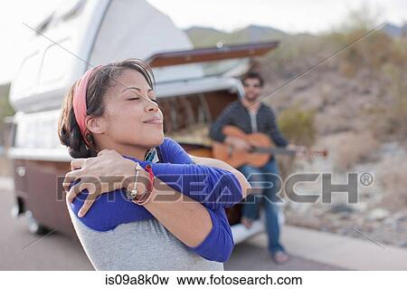 Young woman dancing on road View Large Photo Image Stock Photo - Young woman dancing on road. Fotosearch