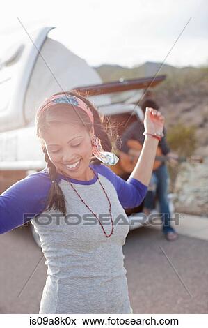 Young woman dancing on road View Large Photo Image Stock Photo - Young woman dancing on road. Fotosearch