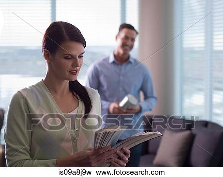 Young woman looking at colour swatches View Large Photo Image Stock Photo - Young woman looking at colour swatches. Fotosearch