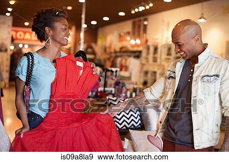 Young woman showing man red vintage dress View Large Photo Image Stock Photo - Young woman showing man red vintage dress. Fotosearch