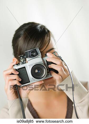 Young woman taking photograph View Large Photo Image Stock Photography - Young woman taking photograph. Fotosearch
