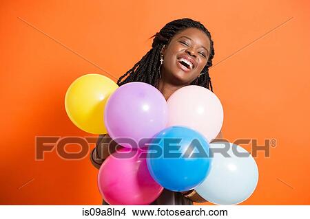 Picture - Young woman with balloons. Fotosearch