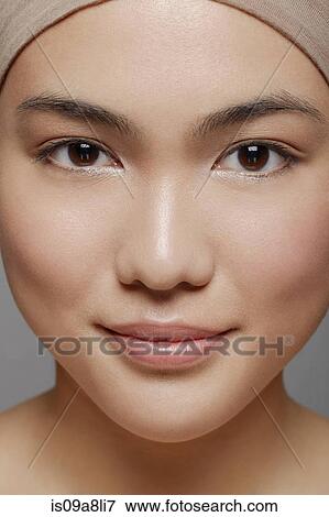 Young woman with brown eyes looking at camera View Large Photo Image Stock Photo - Young woman with brown eyes looking at camera. Fotosearch