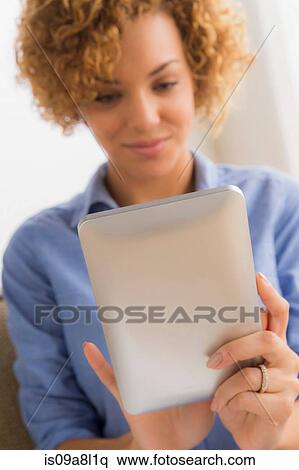 Young woman with electronic book View Large Photo Image Stock Photography - Young woman with electronic book. Fotosearch