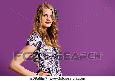 Stock Photo - Young woman with long blonde hair, portrait. Fotosearch