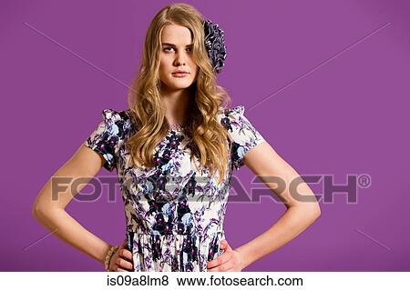 Stock Photo - Young woman with long blonde hair, portrait. Fotosearch