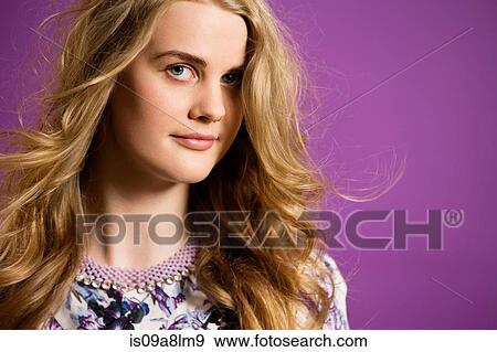 Young woman with long blonde hair, portrait View Large Photo Image Stock Photo - Young woman with long blonde hair, portrait. Fotosearch