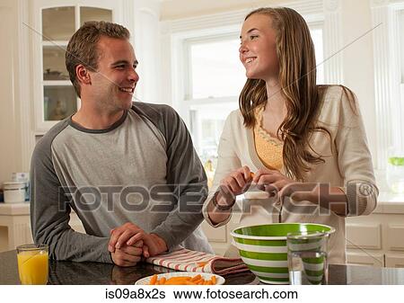Brother and sister preparing food View Large Photo Image Stock Photograph - Brother and sister preparing food. Fotosearch