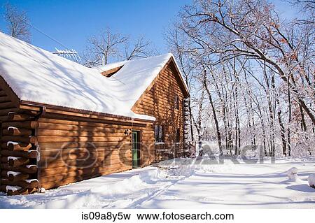 Stock Photo - Cabin in snow covered forest. Fotosearch